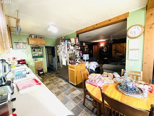 kitchen featuring a textured ceiling and ceiling fan