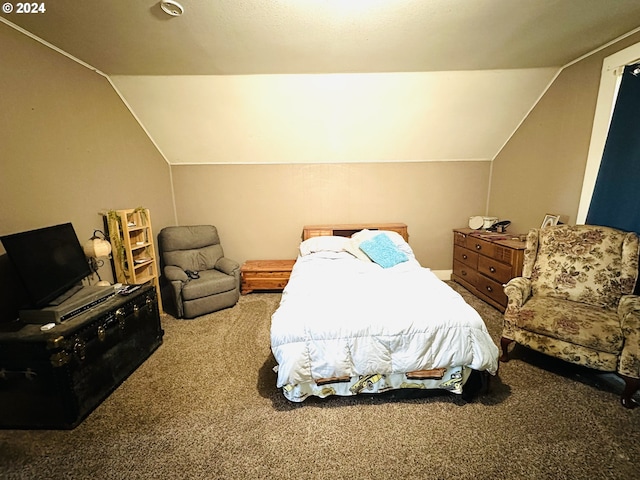 carpeted bedroom with lofted ceiling