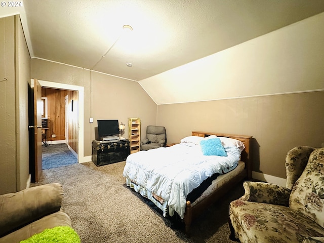 carpeted bedroom featuring vaulted ceiling