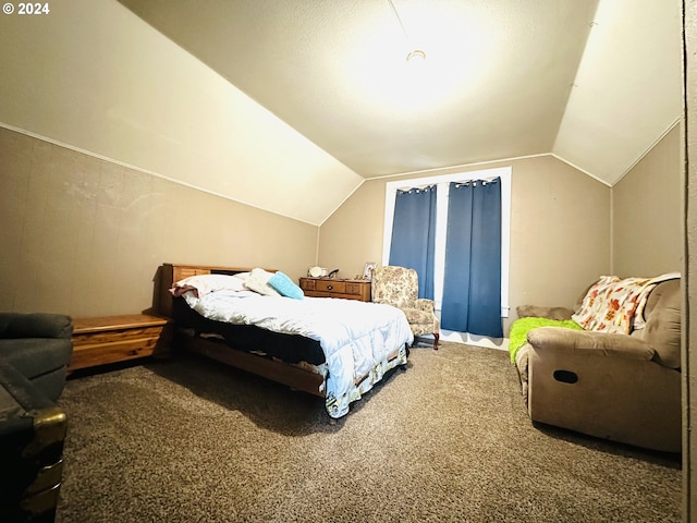 bedroom with carpet flooring and lofted ceiling