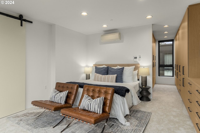 carpeted bedroom with a barn door and a wall mounted AC