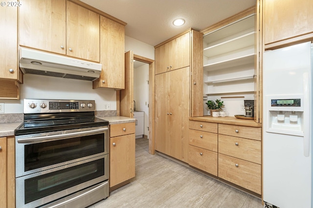 kitchen with light brown cabinets, under cabinet range hood, double oven range, white fridge with ice dispenser, and light countertops