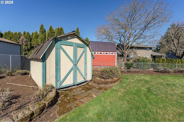 view of shed featuring a fenced backyard