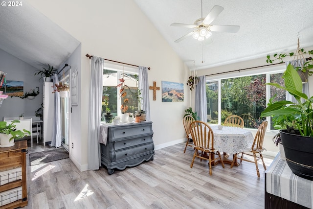 dining space featuring a textured ceiling, ceiling fan, light hardwood / wood-style floors, and a healthy amount of sunlight