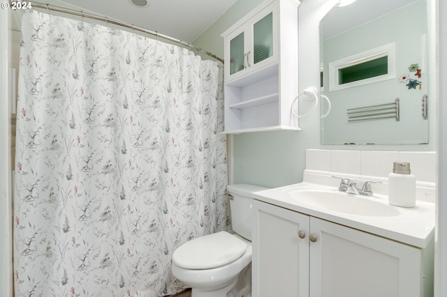 bathroom featuring toilet, vanity, decorative backsplash, and a shower with curtain