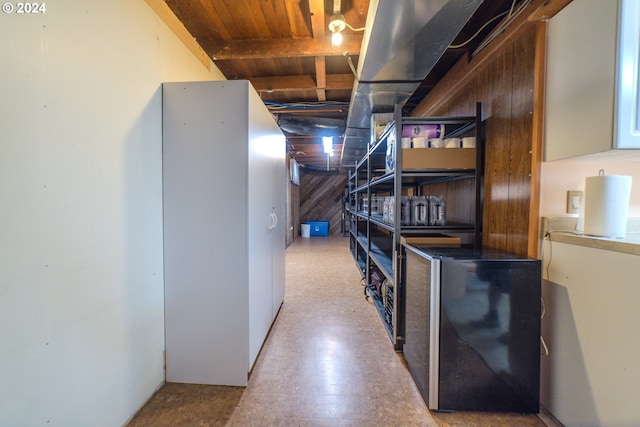 basement with wooden walls and wooden ceiling