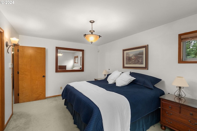 bedroom featuring light colored carpet