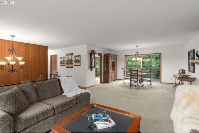 living room featuring light carpet and a notable chandelier