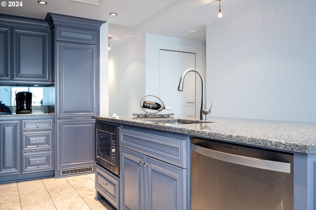 kitchen with dishwasher, stone counters, sink, and wine cooler