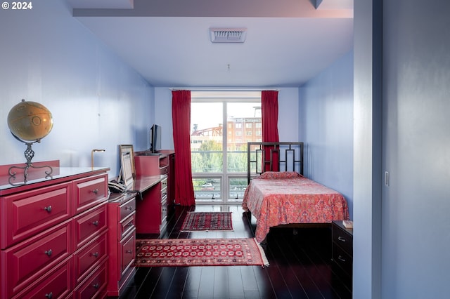 bedroom featuring dark hardwood / wood-style floors