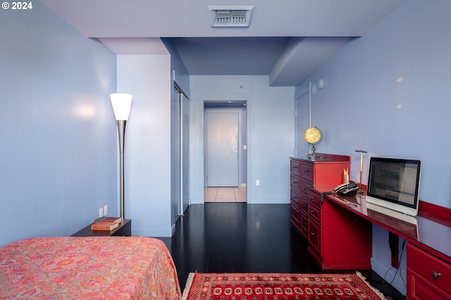 bedroom featuring dark hardwood / wood-style flooring