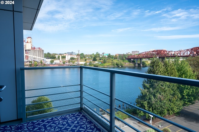 balcony featuring a water view