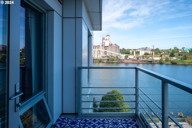 balcony featuring a water view