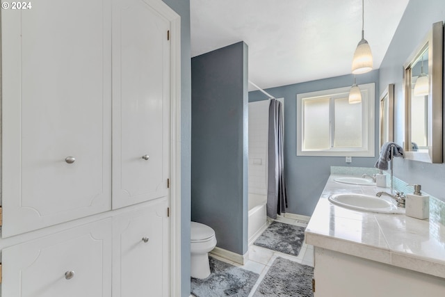 full bathroom featuring vanity, tile patterned flooring, toilet, and shower / bathtub combination with curtain