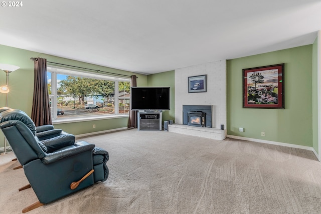 carpeted living room featuring a fireplace