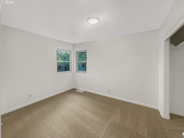 unfurnished bedroom with carpet