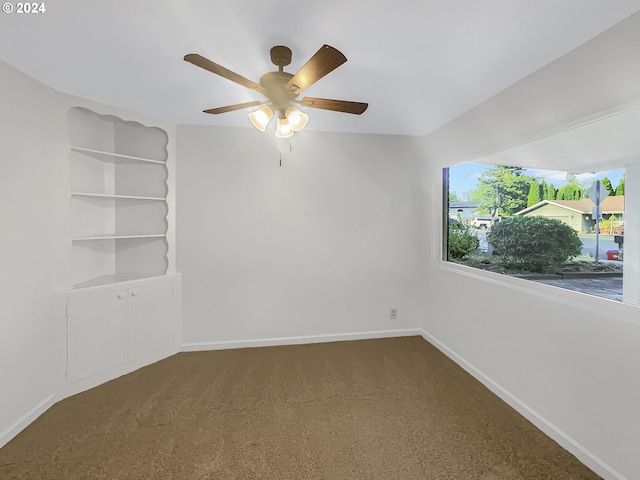 carpeted empty room with ceiling fan