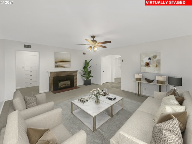 carpeted living room with ceiling fan