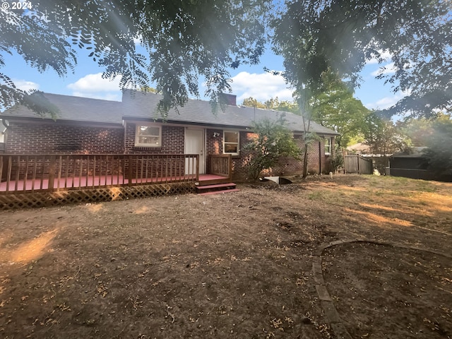 rear view of house with a deck