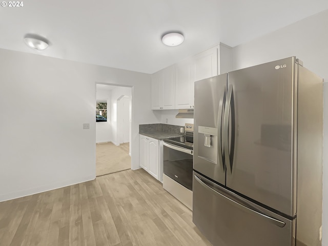 kitchen with white cabinets, stainless steel appliances, and light hardwood / wood-style floors