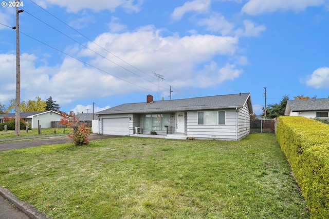 single story home with aphalt driveway, a garage, fence, a chimney, and a front yard