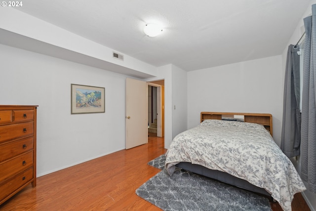 bedroom with light hardwood / wood-style floors