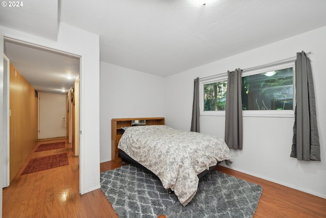 bedroom featuring dark wood-type flooring