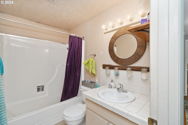 full bathroom featuring backsplash, a textured ceiling, toilet, shower / bath combination with curtain, and oversized vanity