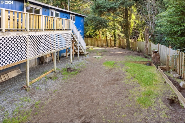 view of yard featuring a wooden deck