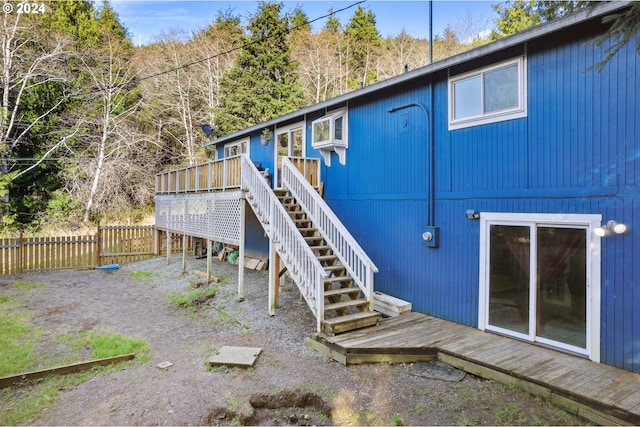 rear view of house with a wooden deck