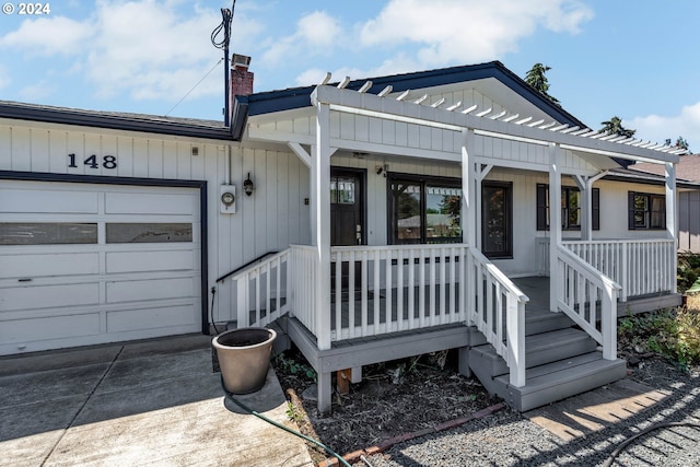 view of front of property featuring a porch and a garage