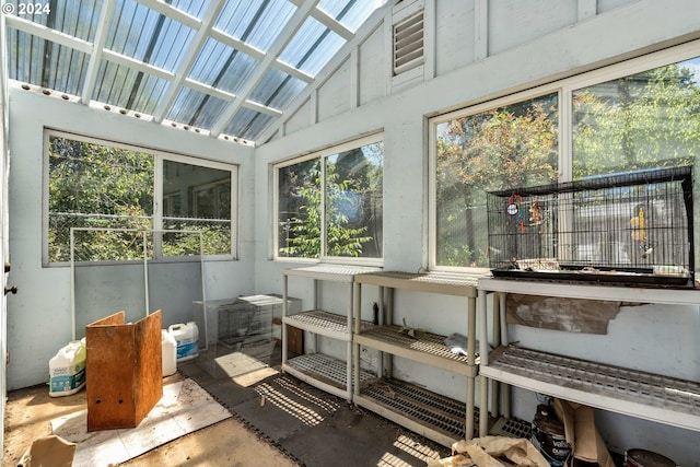 sunroom / solarium featuring lofted ceiling