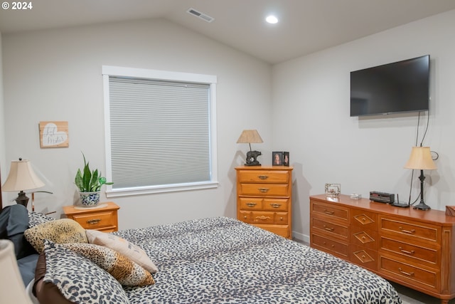 bedroom with lofted ceiling