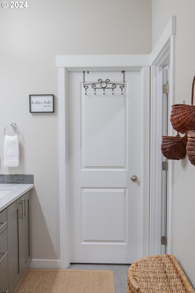 bathroom featuring a shower with door and toilet