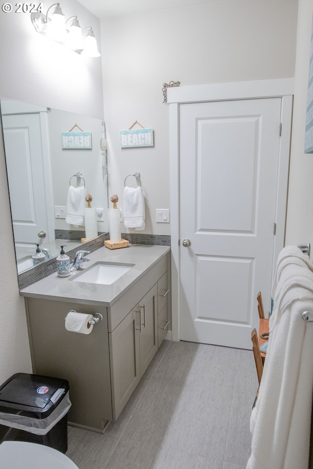 bathroom with vanity and wood finished floors