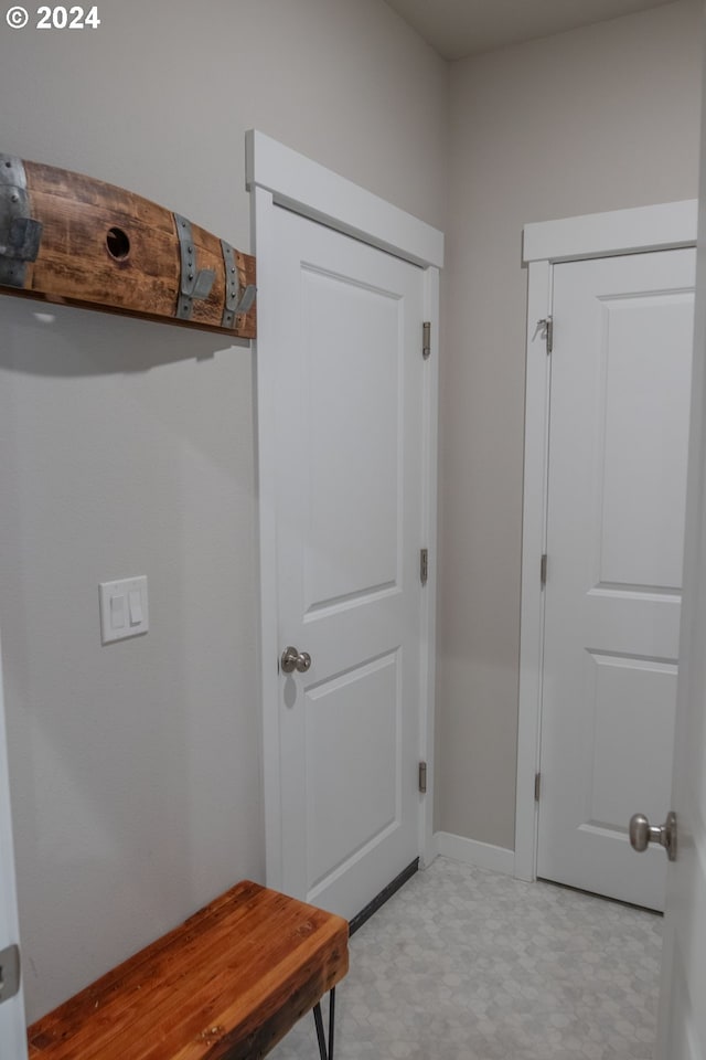 mudroom featuring light floors