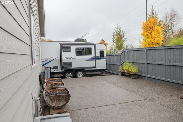 view of patio featuring fence