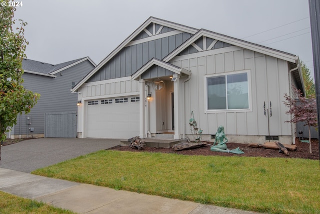 view of front of home featuring a garage, board and batten siding, concrete driveway, and a front yard