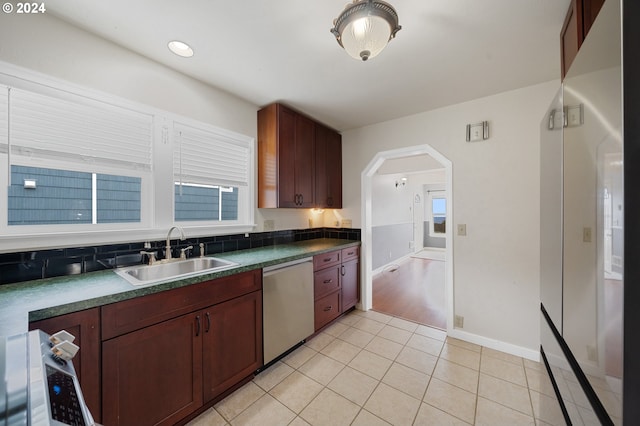 kitchen with sink, light tile patterned floors, and dishwasher