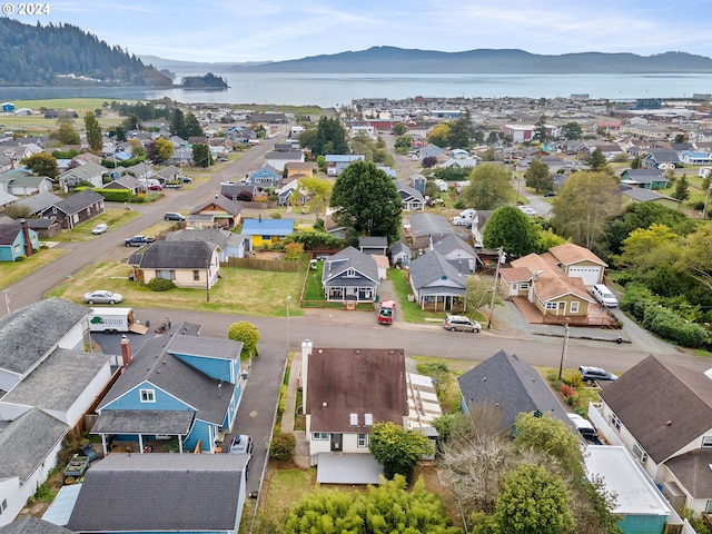 bird's eye view with a water and mountain view