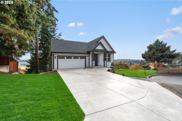 view of front facade featuring a front yard and a garage