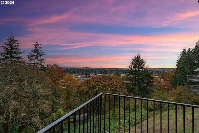 view of balcony at dusk