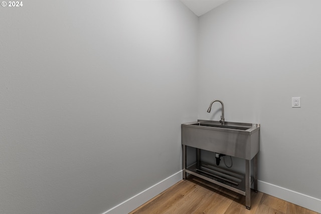 washroom with light hardwood / wood-style flooring