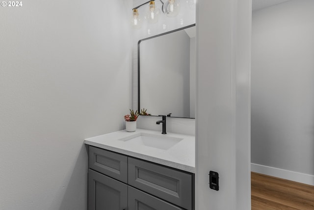 bathroom featuring wood-type flooring and vanity