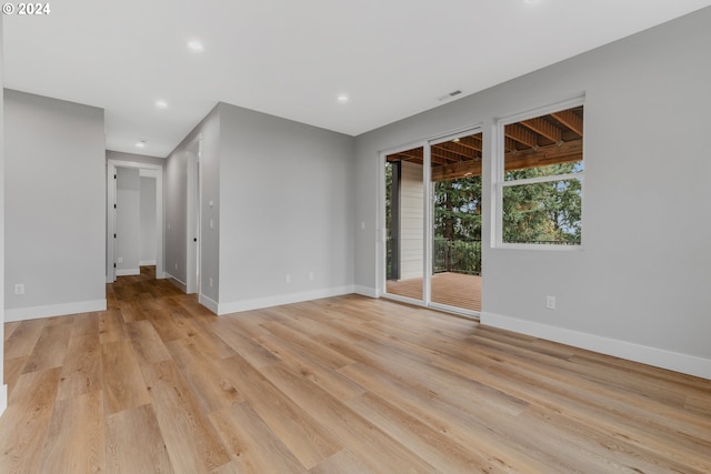 unfurnished room with light hardwood / wood-style floors