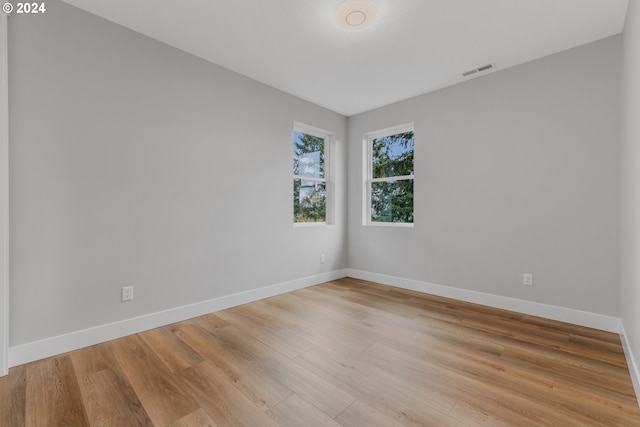 spare room with light wood-type flooring