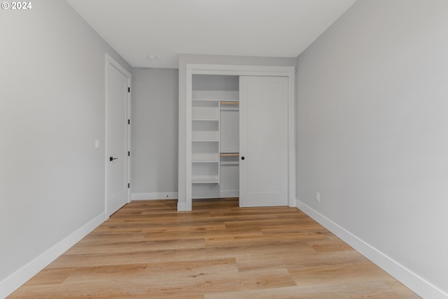 unfurnished bedroom featuring light wood-type flooring