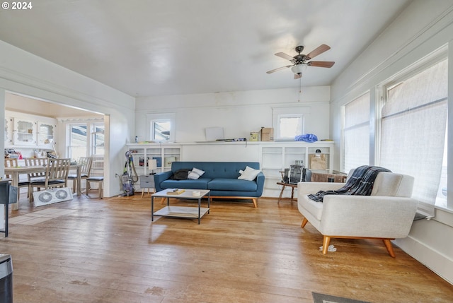 living room with hardwood / wood-style flooring and a healthy amount of sunlight