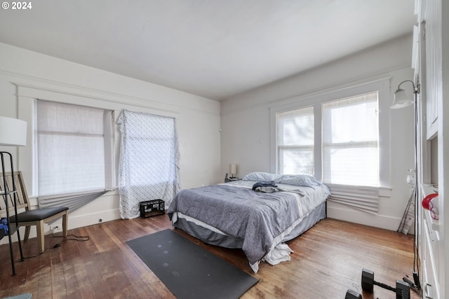 bedroom with wood-type flooring