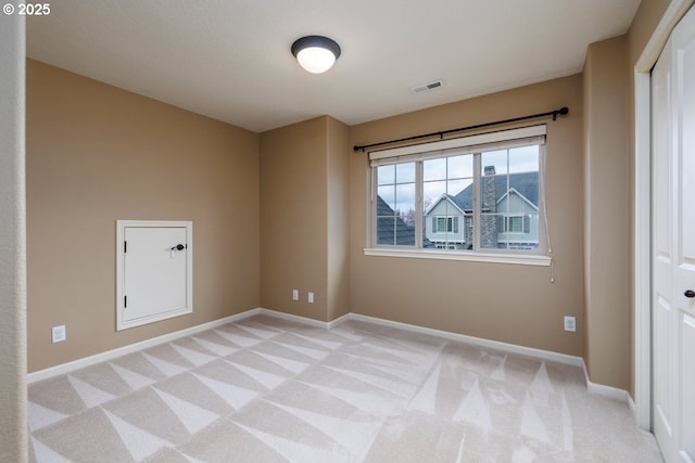 5310 NW Primino Ave, Portland, OR 97229 - spare room with visible vents, baseboards, and light colored carpet